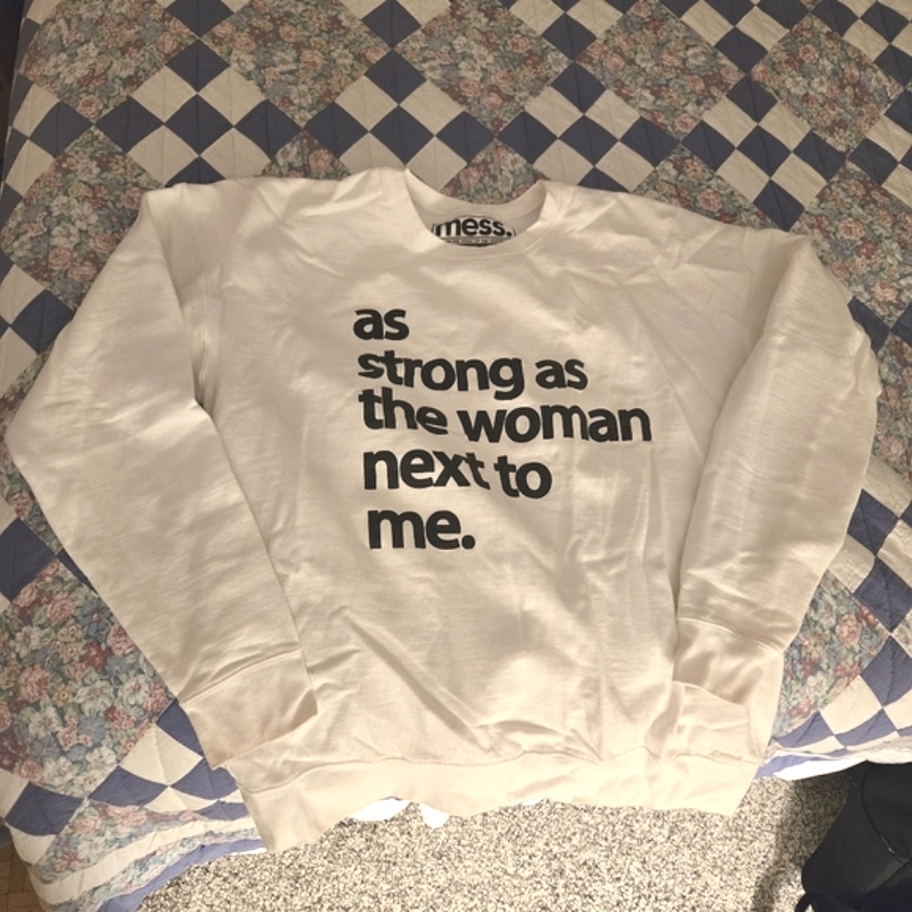 Soft white crewneck "as strong as the woman next to me"